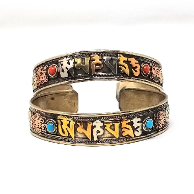 Pulsera tres metales "Om mane..." con filigrana